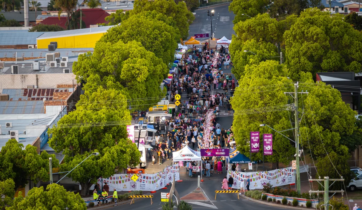 Aerial view of crowds and the long table stretching the length of Heeney Street